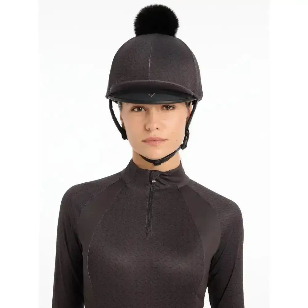 Black lemieux faith hat silk cinder equestrian helmet with a fluffy pom-pom on top for faith base layer use