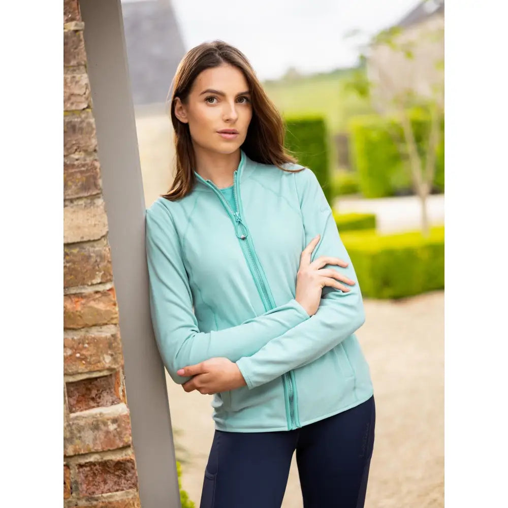 A light teal lemieux faye fleece zip long-sleeved jacket with a sleek modern design perfect for layering