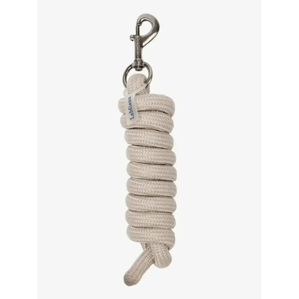 A coiled beige lemieux finesse leadrope stone with a silver metal clip perfect for handling horses