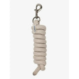 A coiled beige lemieux finesse leadrope stone with a silver metal clip perfect for handling horses