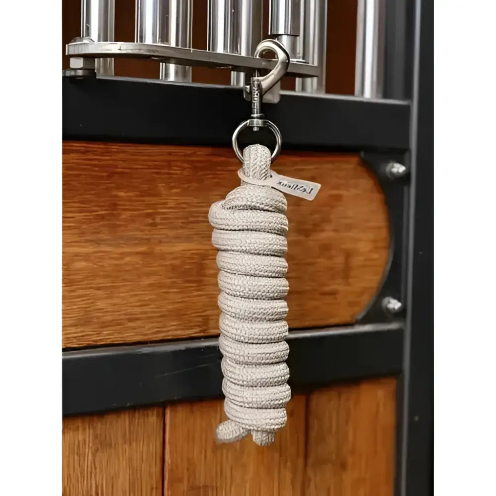 A coiled light gray lemieux finesse leadrope stone with a silver metal hook and ring for easy attachment