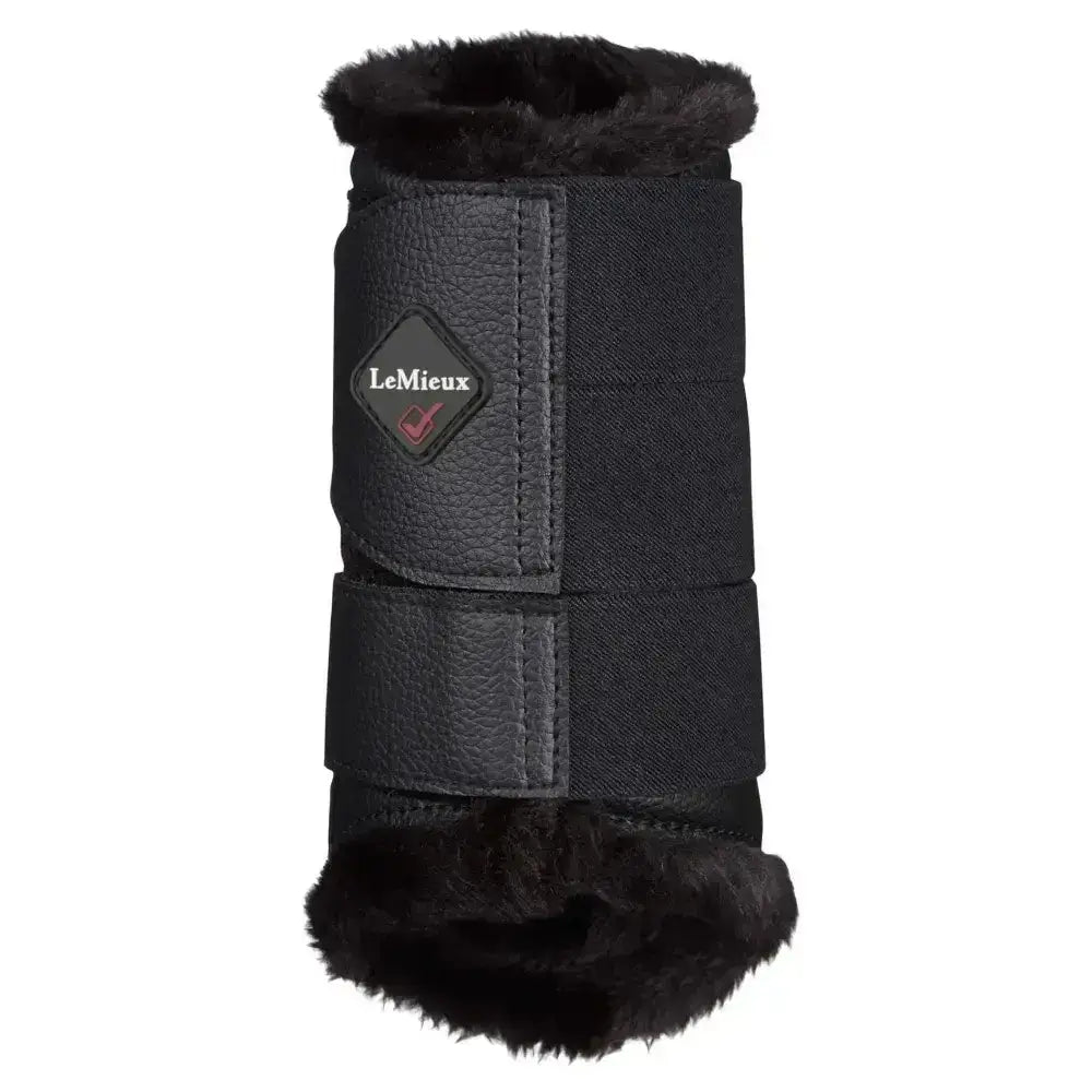 Black lemieux fleece lined brushing boots with plush fur lining and textured leather straps for great fit