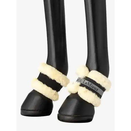 Black lemieux fleece pastern wrap with cream fleece trim and branded strap lightweight lemieux fleece design