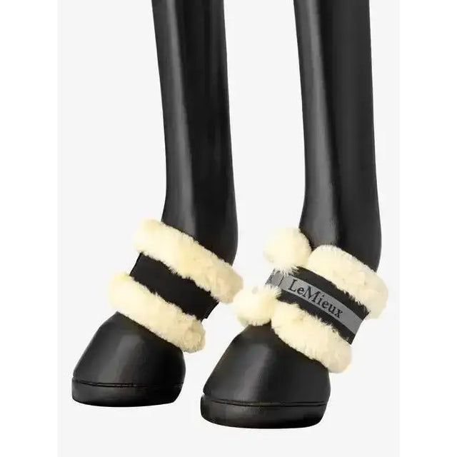 Black lemieux fleece pastern wrap with cream fleece trim and branded strap lightweight lemieux fleece design