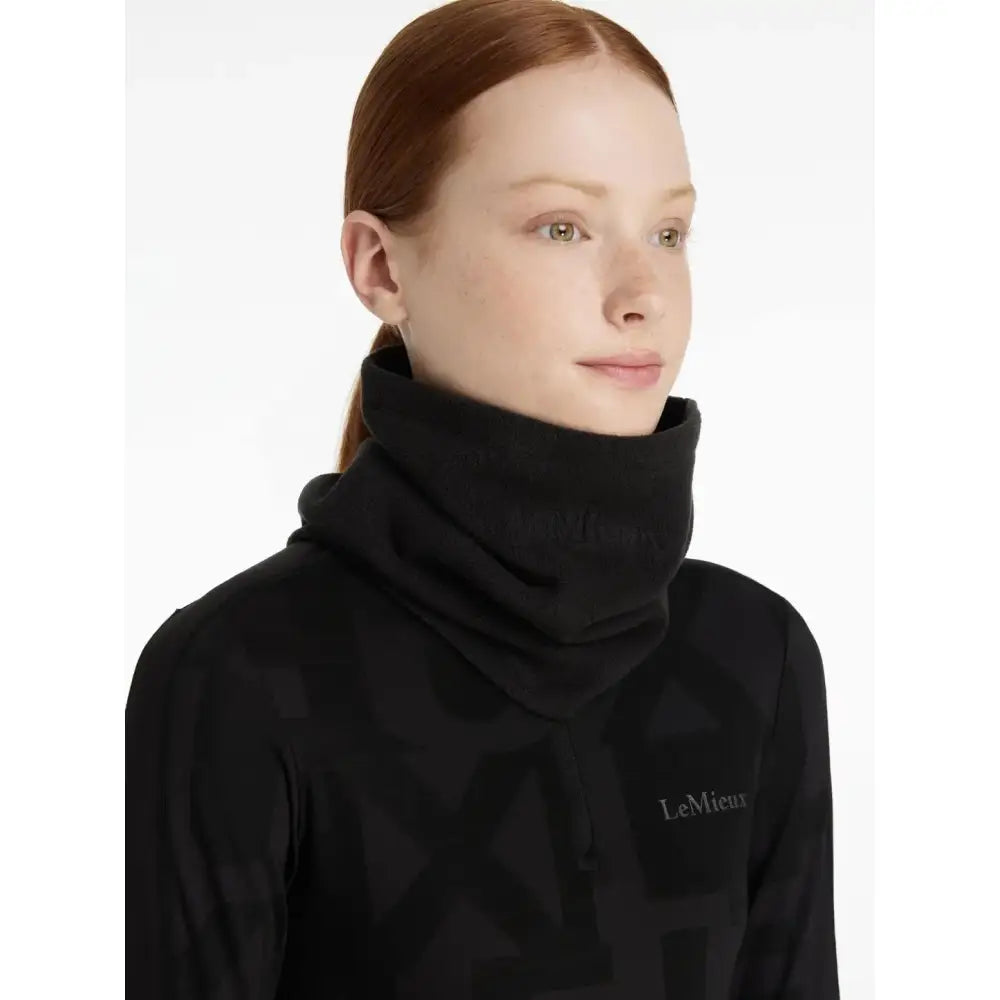 Black high neck fleece snood with subtle embroidered logo from lemieux fleece snood black collection