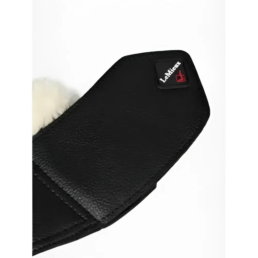Black textured faux leather lemieux fleece wrapround overreach boots with white fur lining and small lemieux logo patch