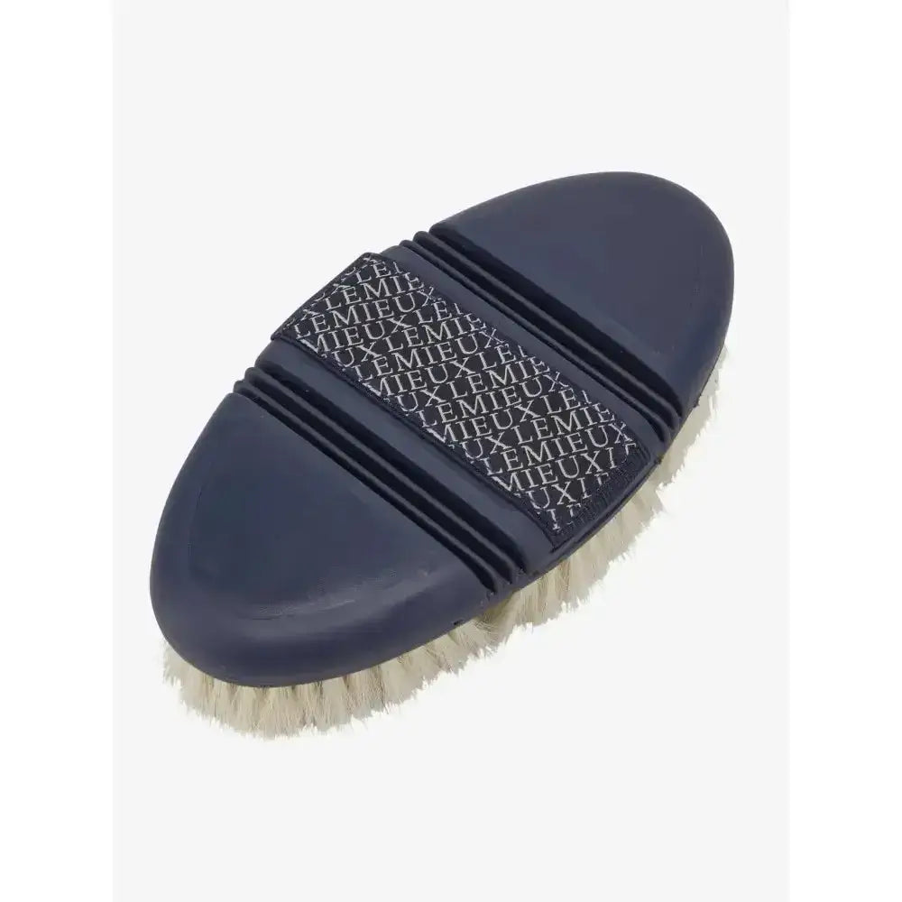 Navy lemieux flexi goat hair body brush with white bristles and repeating lemieux logo on the handle