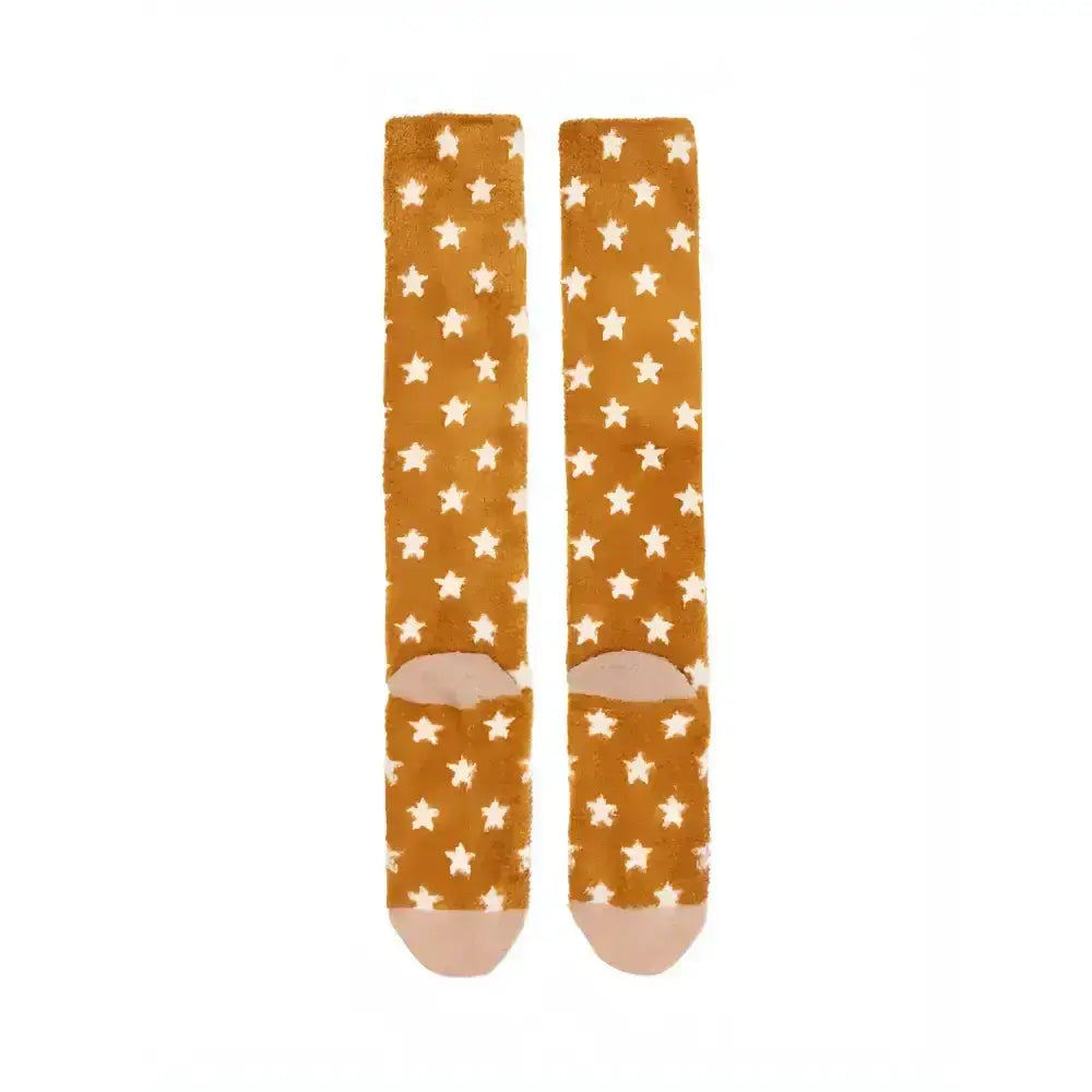 A pair of lemieux fluffy character socks chancer in mustard yellow with white stars soft fabric and rounded toe caps