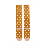A pair of lemieux fluffy character socks chancer in mustard yellow with white stars soft fabric and rounded toe caps