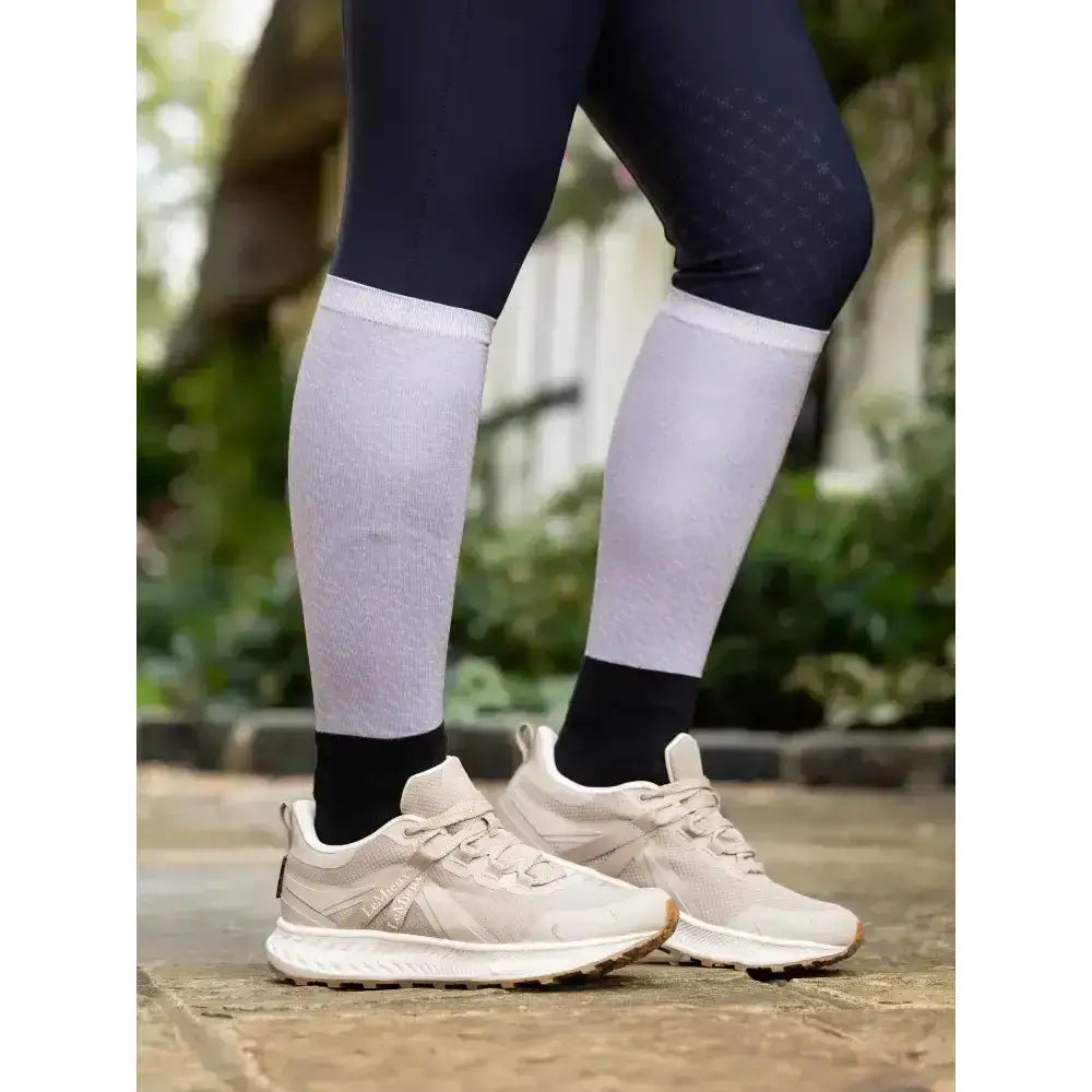 Light gray lemieux footsie socks alexia ash with ribbed texture and black cuffs worn over dark leggings funky style riding socks