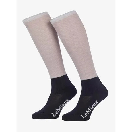 A pair of lemieux footsie socks alexia ash in light beige and black with white brand embroidery perfect funky style riding socks