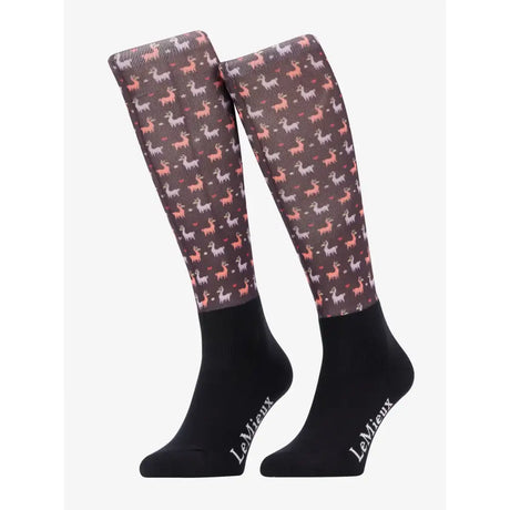 A pair of lemieux footsie socks llamas damson knee-high dark gray with pink and white reindeer hearts and stars pattern