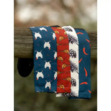 Four patterned neckties in navy blue red and white featuring deer heads cornucopias pinecones and chili peppers for lemieux footsie socks pine cones