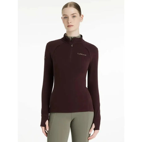 A maroon lemieux fleece damson frances quarter zip with long sleeves, quarter-zip collar, and subtle chest logo