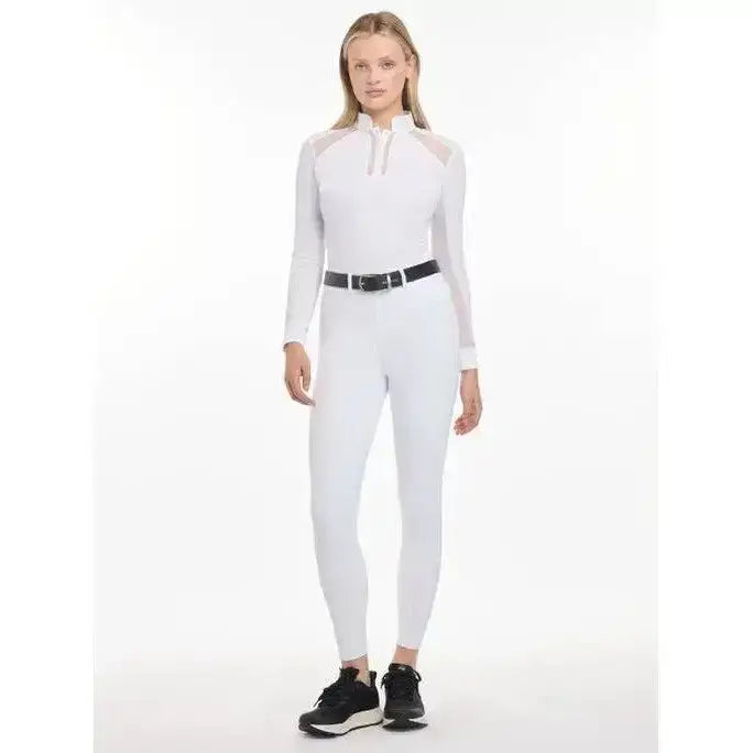 White long-sleeved lemieux freya pro breeches with sheer mesh panels and quarter-zip in highly durable fabric