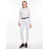 Woman in Lemieux Freya Pro Breeches White with black belt and dark sneakers