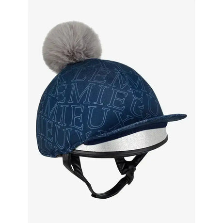 Navy blue lemieux frieda hat silk with light gray logo stitching and a fluffy silver pom pom on top