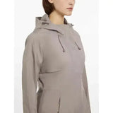 A sleek light gray lemieux grace long rain jacket pecan with a hood and subtle drawstring details perfect for wet weather