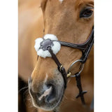 Brown horse wearing a lemieux grackle bridle with black leather and white merino wool fur trim and decorative stitching
