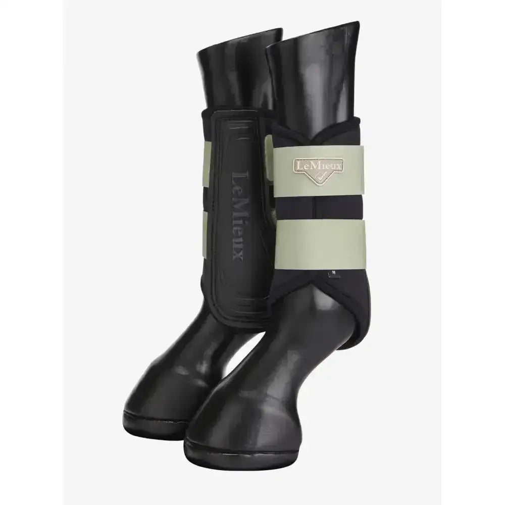 Black lemieux grafter boots with reflective beige and black stripes offer durable protection for horse legs
