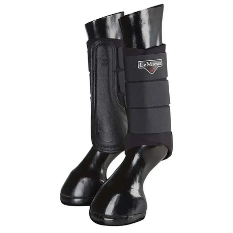 Black lemieux grafter brushing boots with glossy finish and adjustable straps for horse leg protection