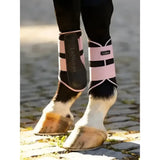 Pink and black lemieux grafter brushing boots blossom with white trim for horse leg protection and support