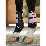 Pink and black lemieux grafter brushing boots blossom with sleek design for horse leg protection and support