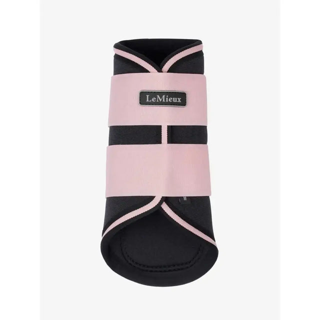 Pink and black lemieux grafter brushing boots blossom with contrasting trim for horse hoof protection