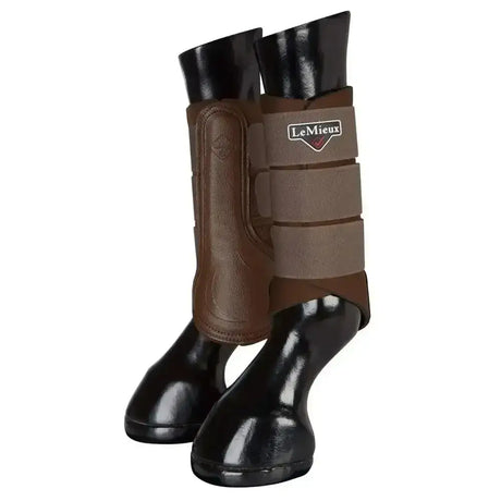 Brown and black lemieux grafter brushing boots with padded adjustable straps highly durable made for horse leg protection
