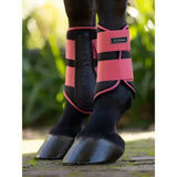 Pink and black lemieux grafter brushing boots cranberry with adjustable straps for horse leg protection