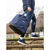 Navy blue lemieux grooming tote with black reinforced bottom and handles perfect as an easy access grab-and-go bag
