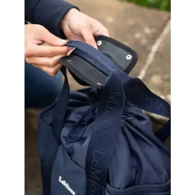 Navy blue fabric lemieux grooming tote with black strap and embossed branding perfect easy access grab-and-go bag