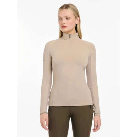 Beige long-sleeved high neck lemieux halle lightweight base layer almond with zipper at collar