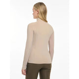 Beige long-sleeved turtleneck with smooth form-fitting fabric in lemieux halle lightweight base layer almond