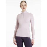 A soft lavender lemieux halle lightweight long-sleeved base layer with high collar and quarter-zip closure