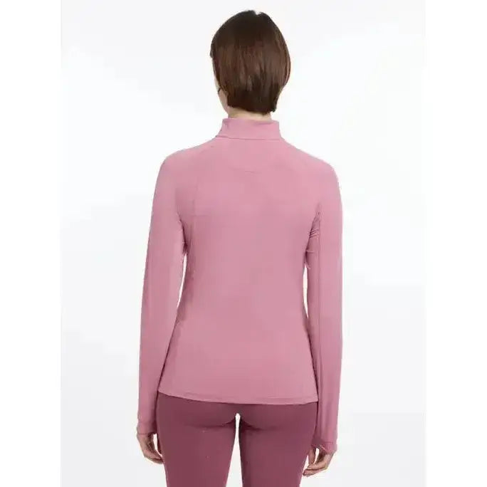 A soft pink lemieux halle lightweight base layer peony with long sleeves and smooth, form-fitting fabric