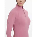 A soft pink lemieux halle lightweight base layer peony with long sleeves high collar and zipper detail
