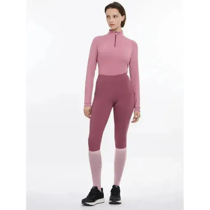 A lemieux halle lightweight two-piece base layer peony set in soft pink with zip-neck top and high-waisted leggings
