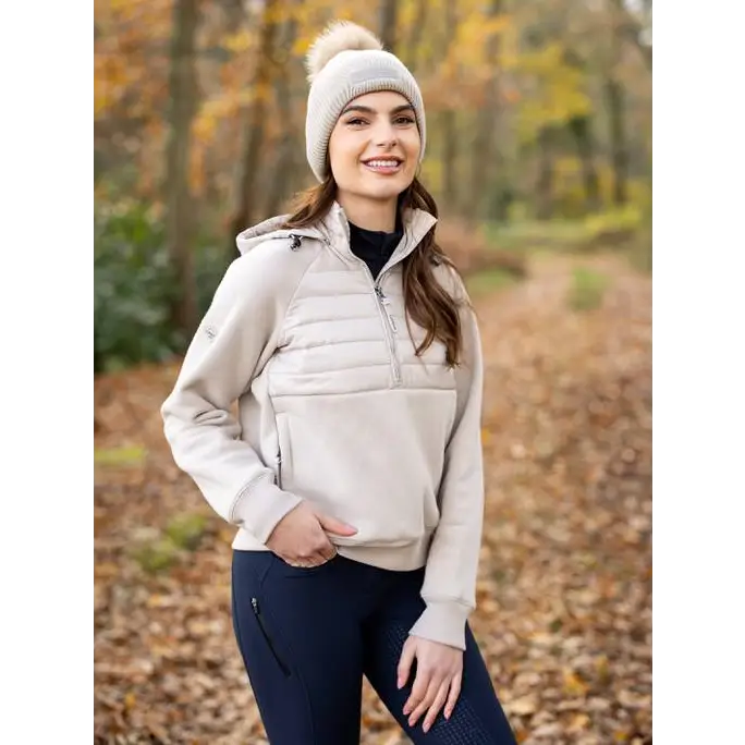 Woman in Lemieux Harley Hybrid Hoodie Stone, beige fleece pullover, autumn vibes