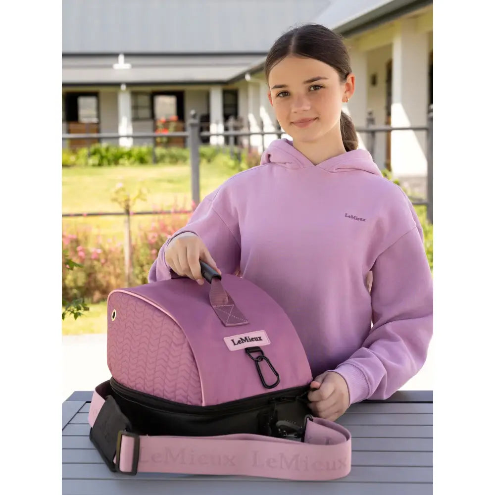 Pink lemieux hat box mallow with quilted texture and black accents perfect for stylish horse riders