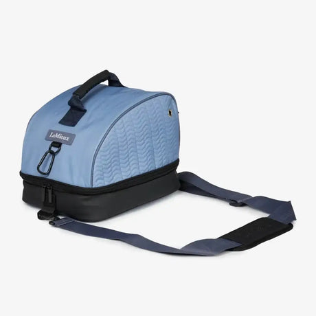Light blue quilted lemieux hat box powder blue with black accents and grab handles for easy carrying