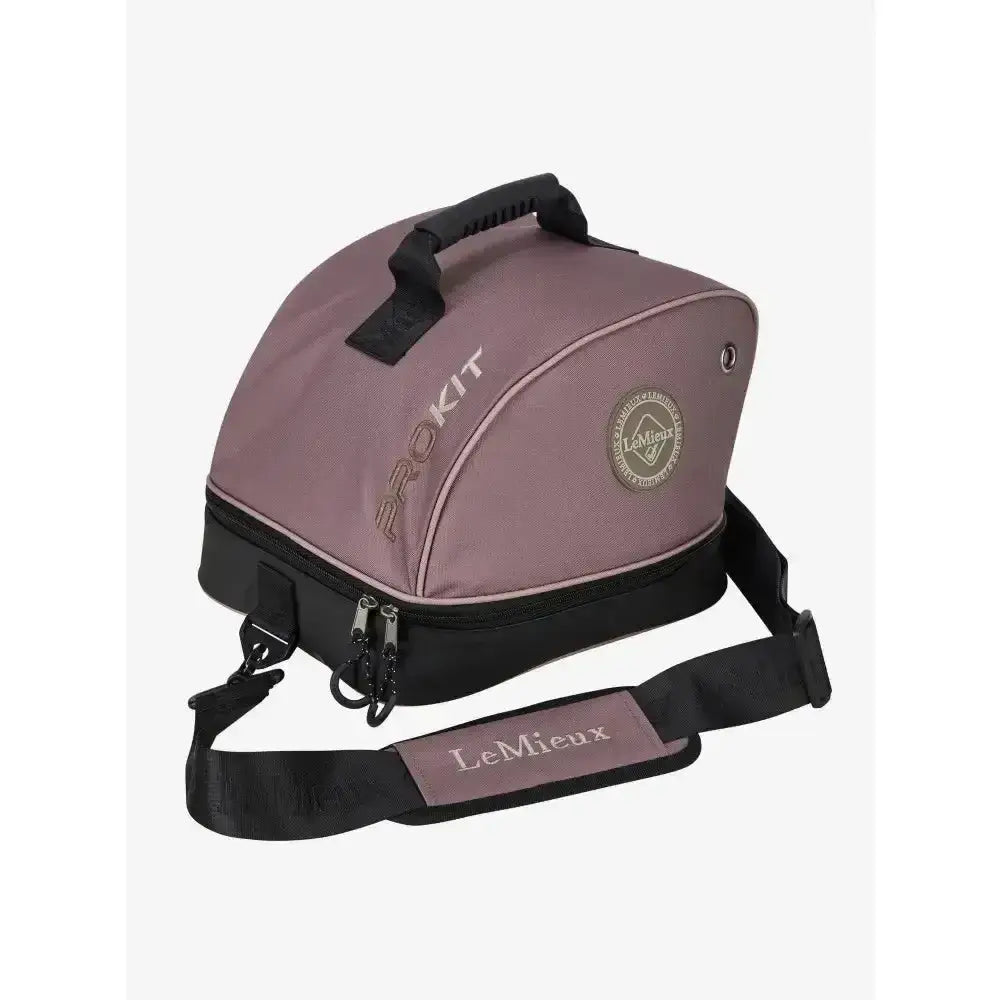 A mauve lemieux hat box walnut with black trim handle and adjustable strap for riding hat bags storage and transport