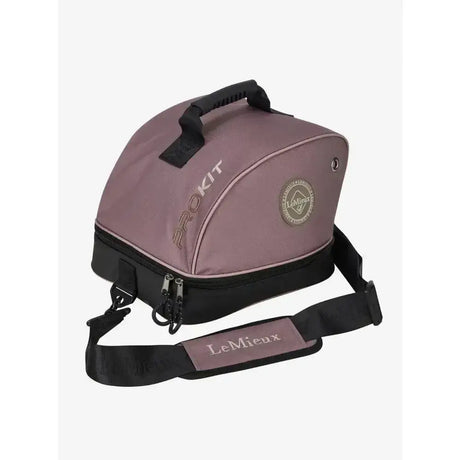 A mauve lemieux hat box walnut with black trim handle and adjustable strap for riding hat bags storage and transport