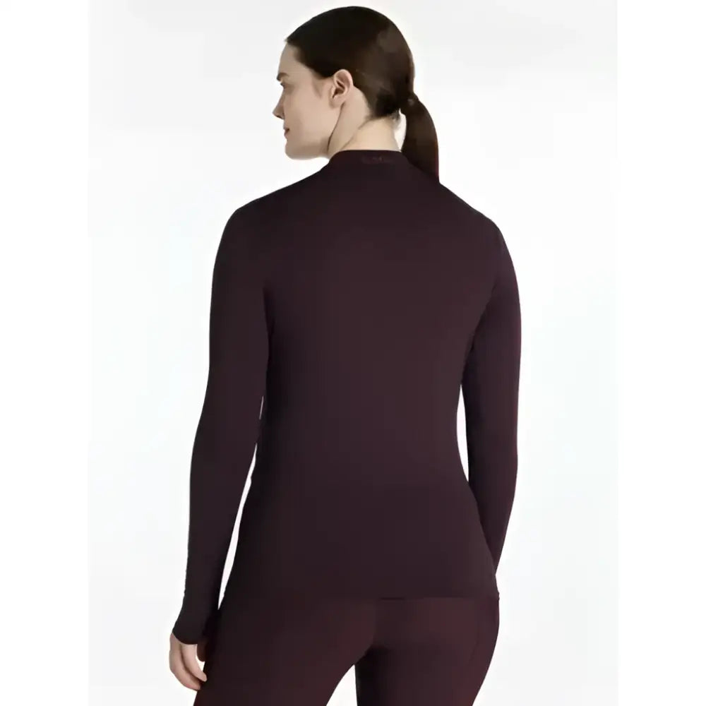 A sleek lemieux heyden lightweight base layer top in damson colour with high neckline and seamless design
