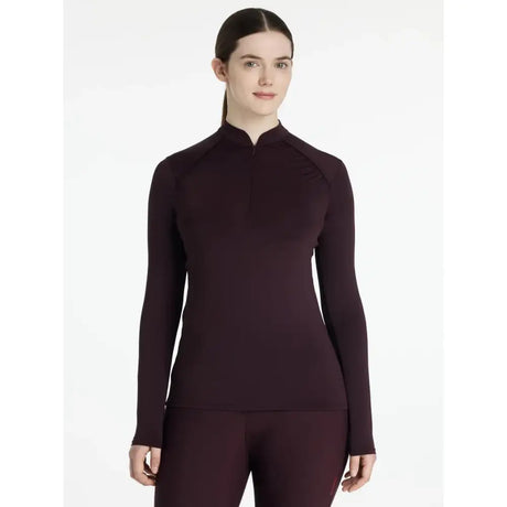 A sleek lemieux heyden lightweight base layer in damson colour with a high collar and quarter-zip closure