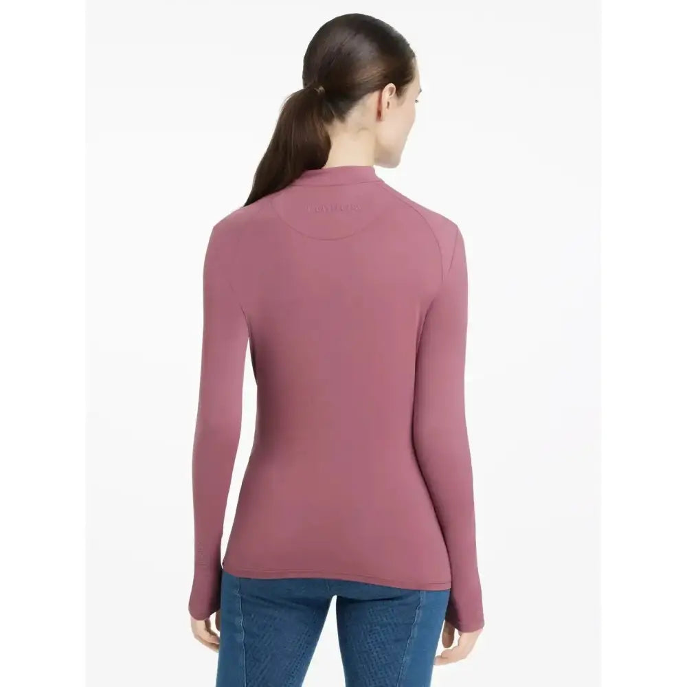 A fitted lemieux heyden lightweight base layer rosewood top with high neckline and soft stretchy fabric