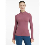A sleek mauve lemieux heyden lightweight base layer rosewood with long sleeves and a quarter-zip neckline seamless design
