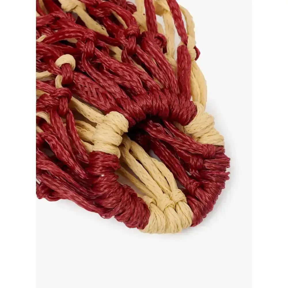 Handcrafted lemieux hippo hay net in burgundy and beige with textured knotted macrame design for feeding hay