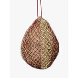 A hanging lemieux hippo hay net burgundy and beige mesh feeder filled with straw for easy hay feeding