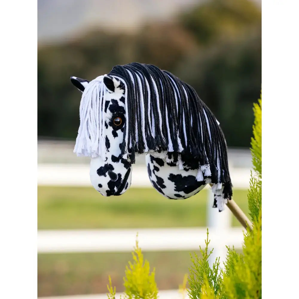 Black and white spotted plush lemieux hobby horse dakota with long striped yarn mane for mini riders